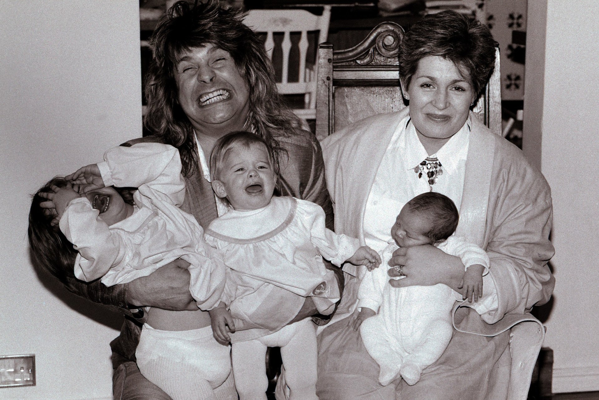 Ozzy and Sharon Osbourne with their screaming children on their laps: Aimee aged 2, Kelly, 1, and newborn baby Jack in November 1985