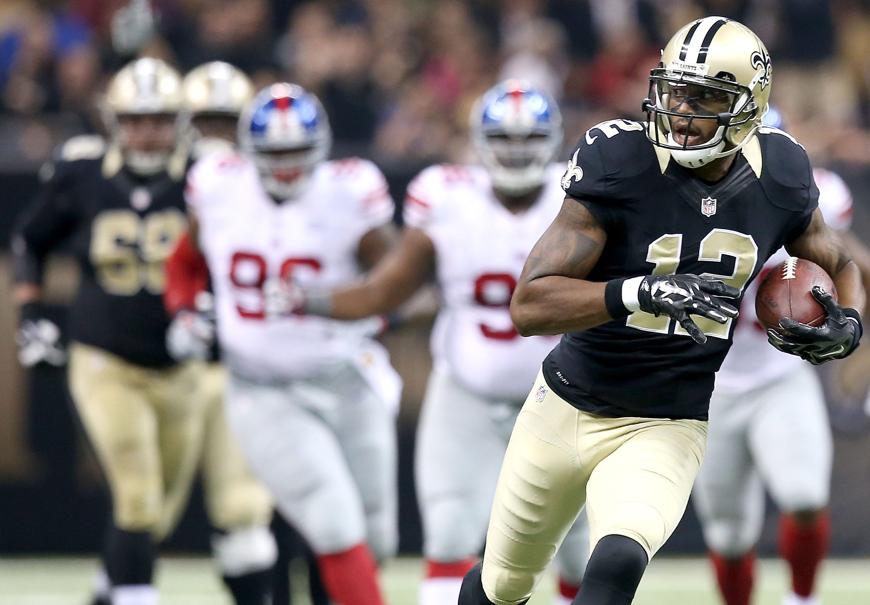 NEW ORLEANS, LA - NOVEMBER 01: Marques Colston #12 of the New Orleans Saints runs for a touchdown against the New York Giants during their game at the Mercedes-Benz Superdome on November 1, 2015 in New Orleans, Louisiana. (Photo by Sean Gardner/Getty Images)