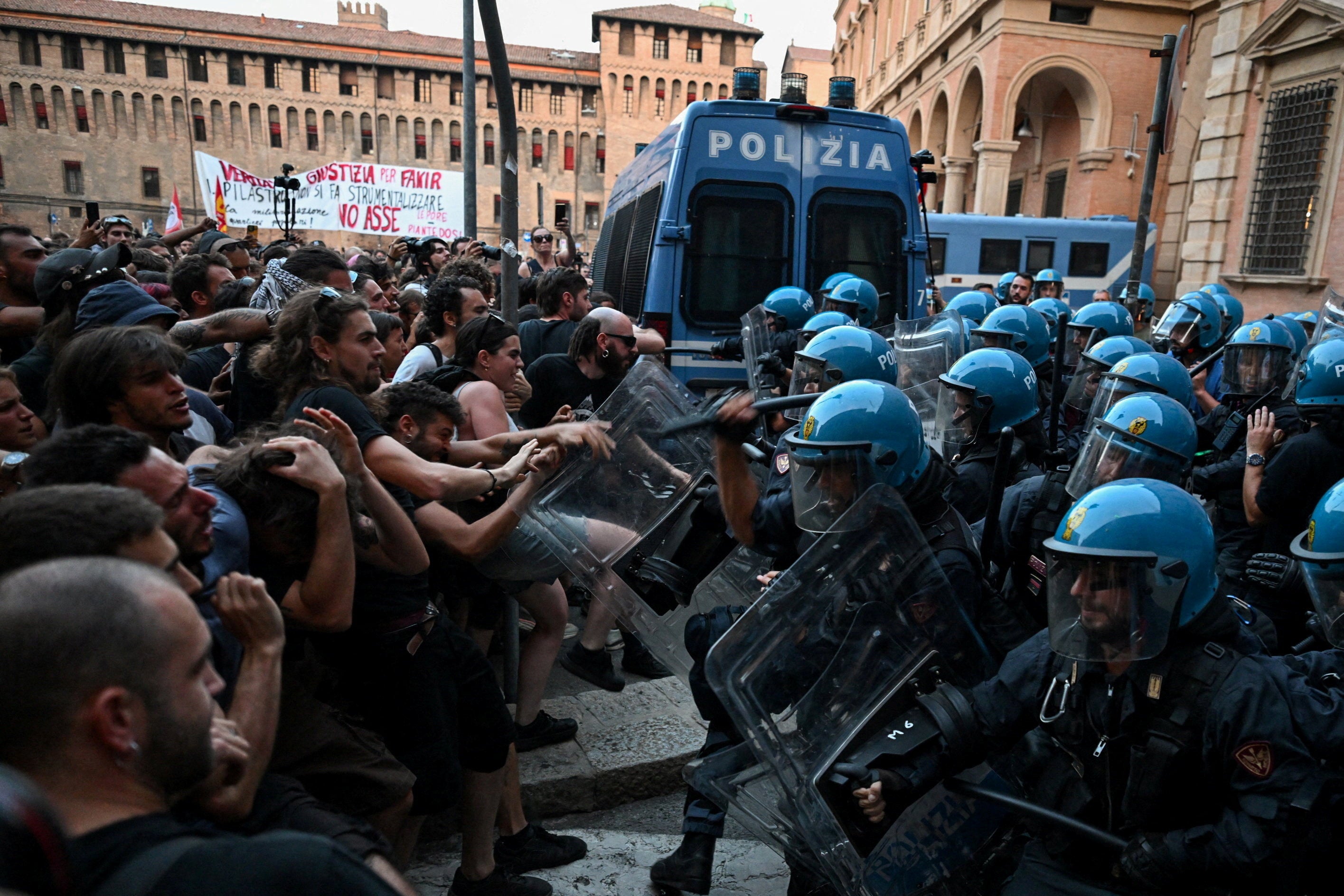 Protesters clash with riot police during a protest following the death of Abderrahim Fakir after he was restrained by police during an attempted detention, in Bologna, Italy, July 20, 2026. (Reuters)