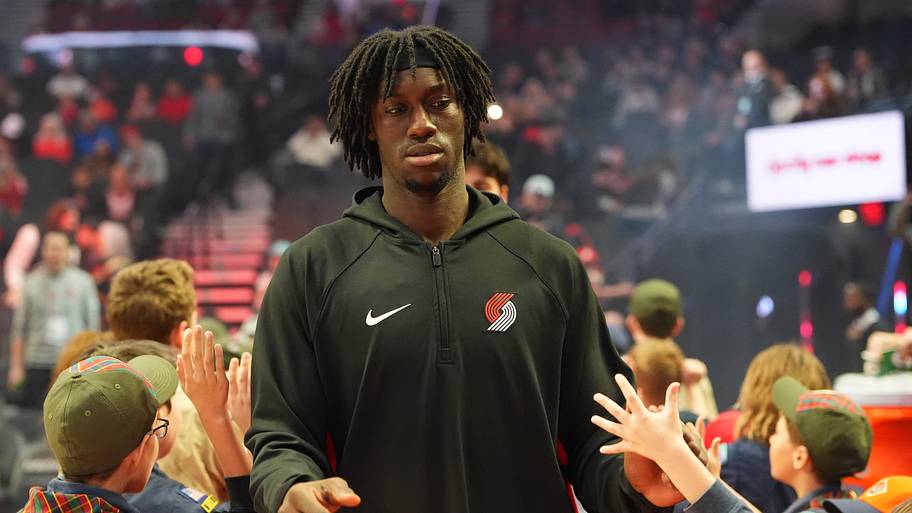Portland Trail Blazers guard Sidy Cissoko greets fans as he walks toward the court
