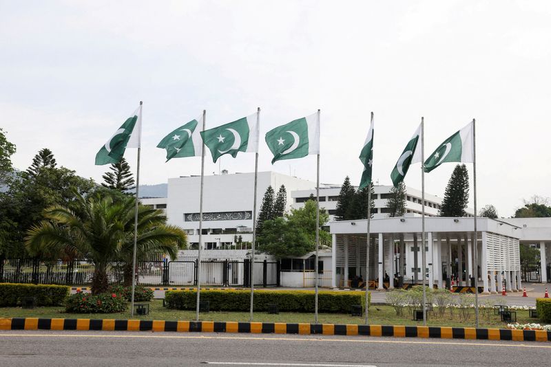 Pakistani flags flutter near the Parliament House in Islamabad, Pakistan, April 11, 2026