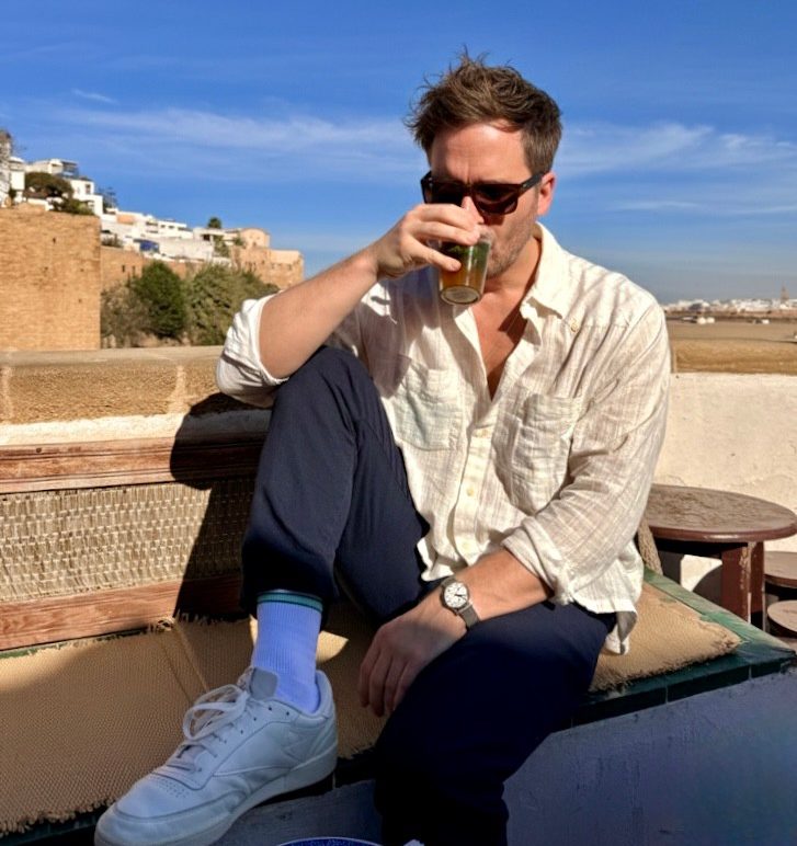 Matt Charlton drinks a cup of tea at Café des Oudayas, Rabat