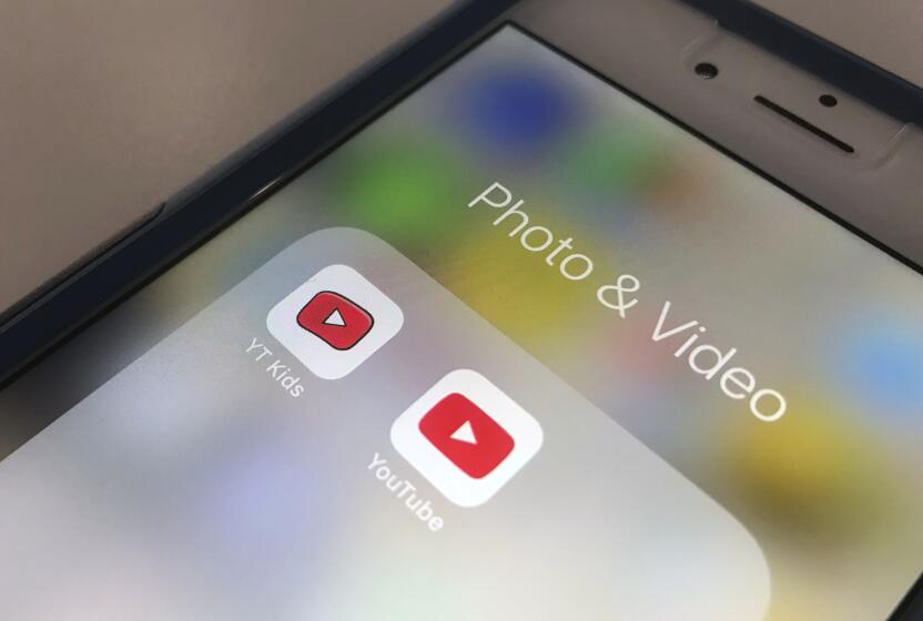 The YouTube and YouTube Kids apps are displayed on an iPhone.