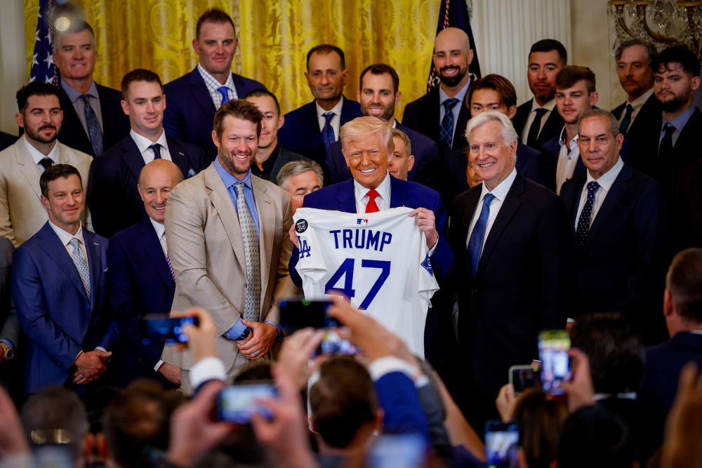 As Dodgers head to White House, loyal fans are conflicted: 'Trump is tearing this city apart'