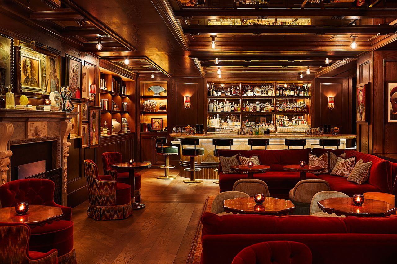 Elegant bar interior with seating decorative shelves and a wellstocked bar counter