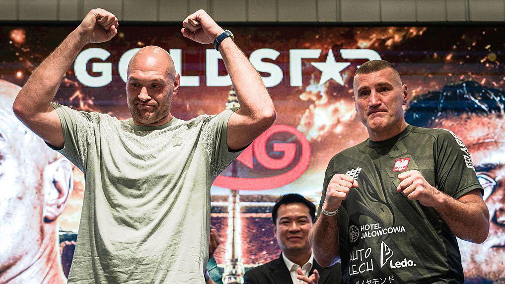 Tyson Fury (left) has won 35 pro fights, with two defeats and one draw