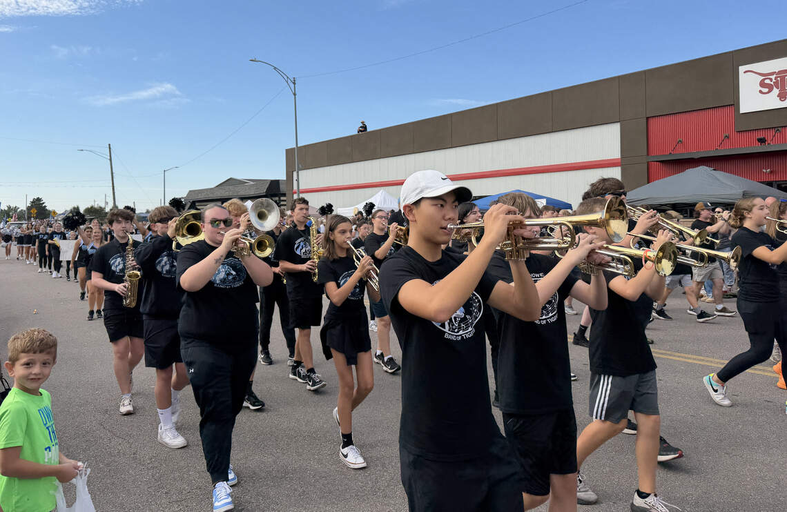 The Eisenhower High School marching band performs during the 2025 Fall Festival in Goddard. This type of community event could receive promotional support from the city’s new tourism website if the branding initiative planned for 2027 is approved in next year’s budget.