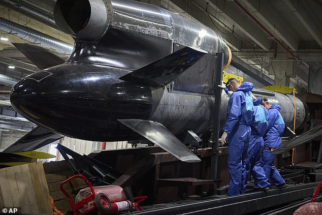 Workers inspect a Flamingo cruise missile at Fire Point's secret factory in Ukraine on Monday, August 18, 2025