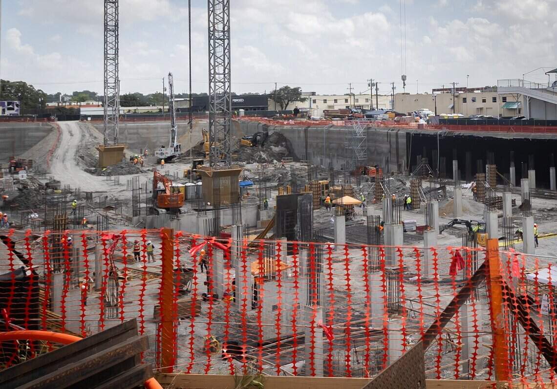 Construction workers prepare the foundation for Goldenrod’s One University development.