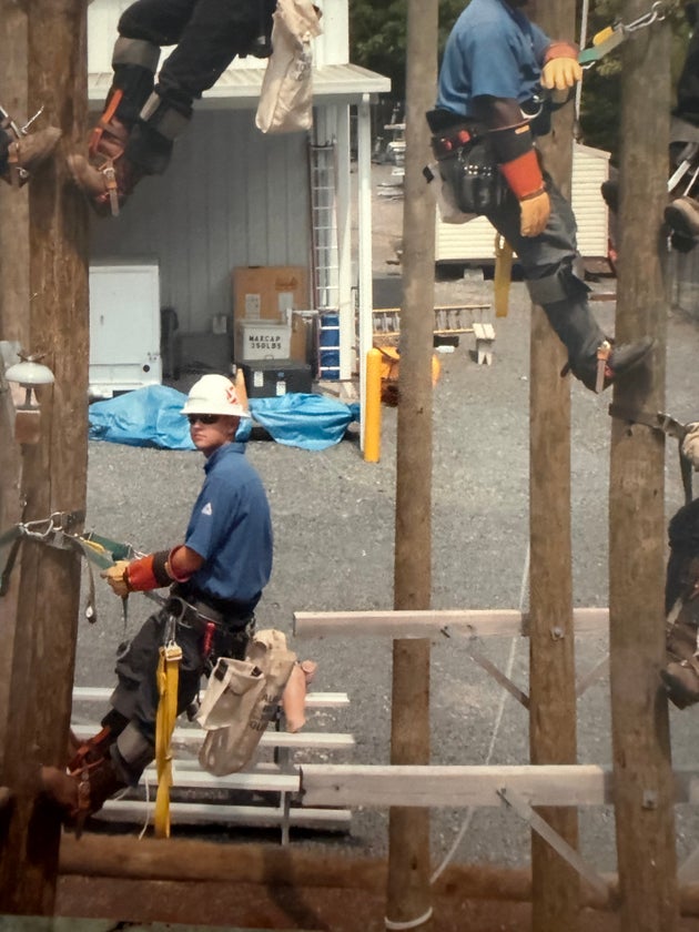 The author's husband during training when he first started as a power lineman.