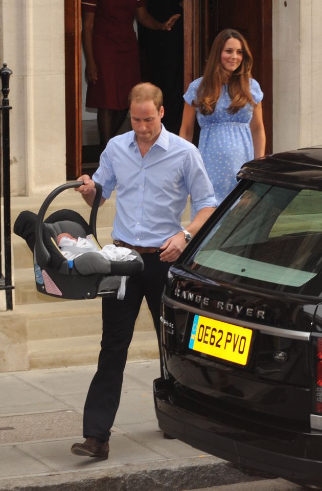 Kate Middleton, Prince William, and Prince George leaving the hospital.