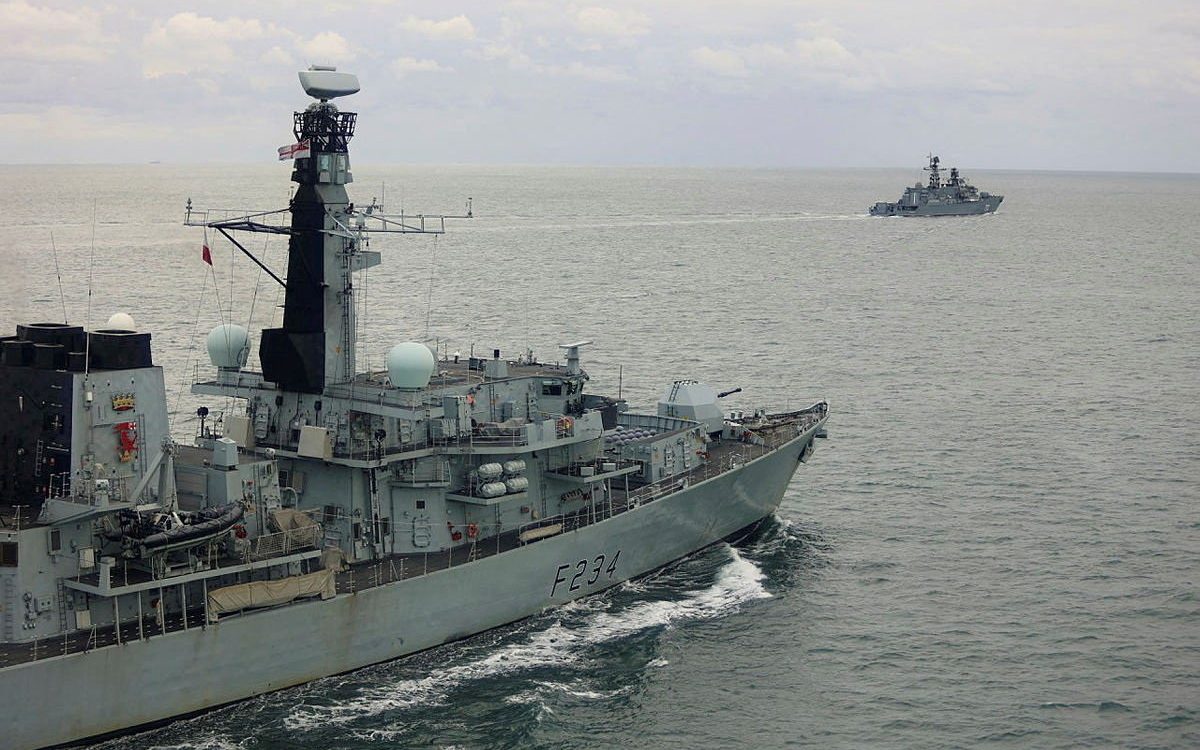 HMS Iron Duke, in the foreground, shadowing the Russian frigate Neustrashimy through the English Channel during an operation