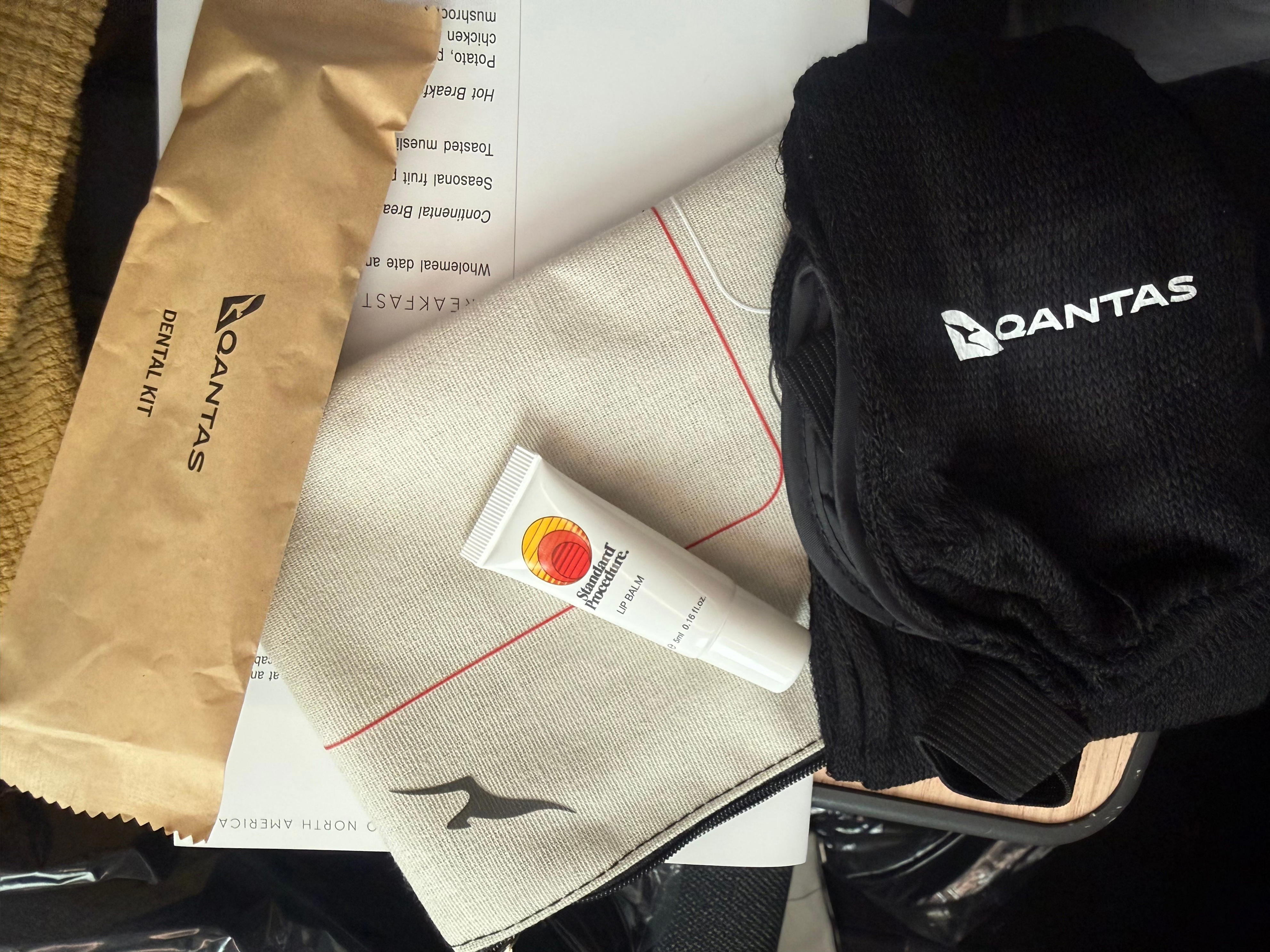 Qantas premium amenity kit on tray table