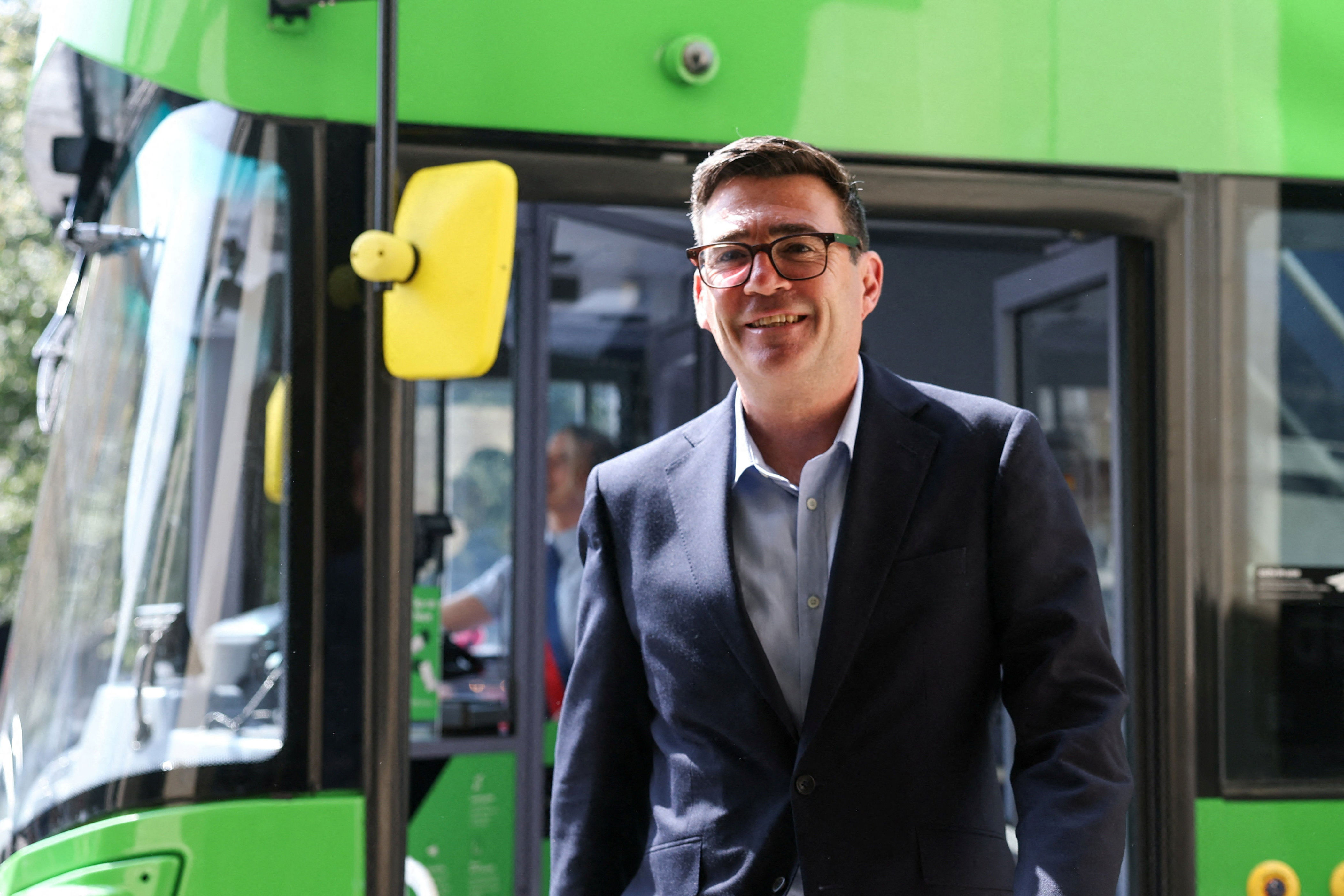 Andy Burnham disembarks a bus after a ride in central Bath (AFP/Getty)