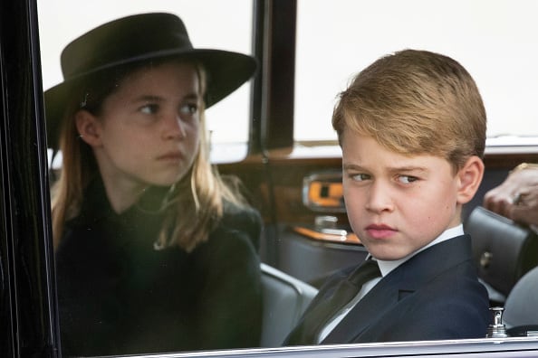 2022: Princess Charlotte of Wales and Prince George of Wales follow the cortège of the late Queen Elizabeth II as it is pulled past the Houses of Parliament after her funeral at Westminster Abbey on September 19, 2022 in London, England. Elizabeth Alexandra Mary Windsor was born in Bruton Street, Mayfair, London on 21 April 1926. She married Prince Philip in 1947 and ascended the throne of the United Kingdom and Commonwealth on 6 February 1952 after the death of her Father, King George VI. Queen Elizabeth II died at Balmoral Castle in Scotland on September 8, 2022, and is succeeded by her eldest son, King Charles III. (Photo by Joshua Bratt- WPA Pool/Getty Images)