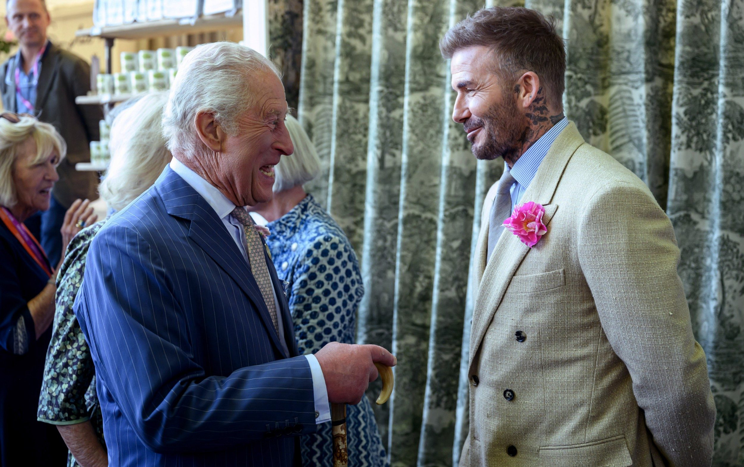 Sir David Beckham, right, wearing a David Austin Roses 'King's Rose' while speaking with the patron of the Royal Horticultural Society at the Chelsea Flower Show, 2025
