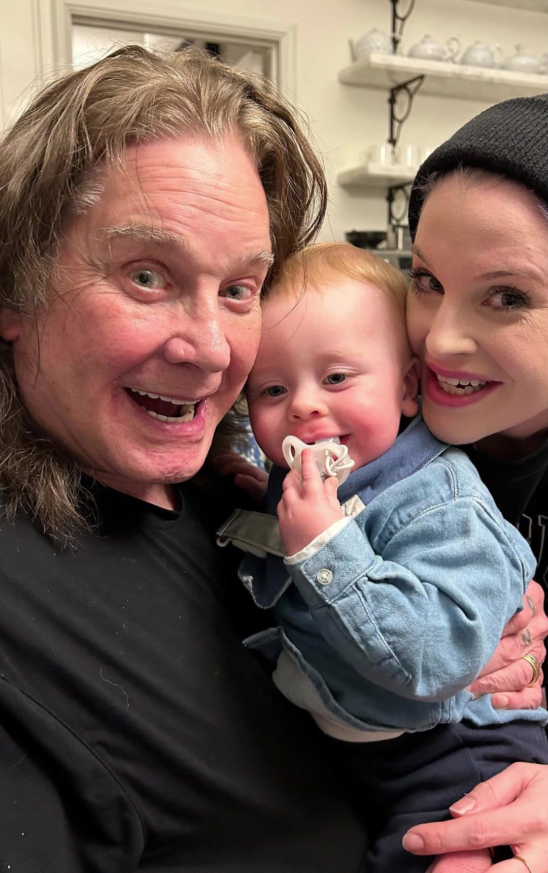 Kelly Osbourne and father Ozzy holding her son Sidney as part of her Father's Day 2026 Instagram post