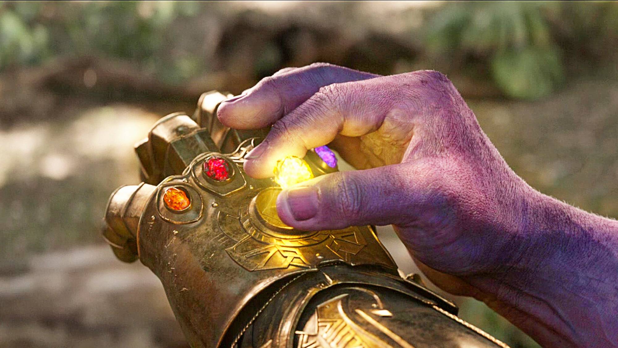 Infinity Stone gaunlet on Thanos' hand in