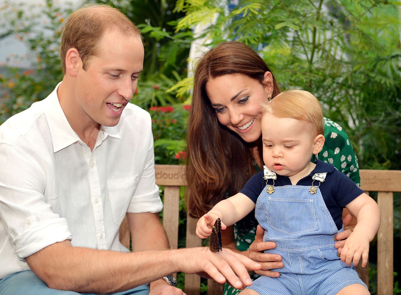 Catherine, Duchess of Cambridge holds Prince George as he points to a butterfly on Prince William, Duke of Cambridge's hand as they visit the Sensational Butterflies exhibition at the Natural History Museum on July 2, 2014 in London, England. The family released the photo ahead of the first birthday of Prince George on July 22.