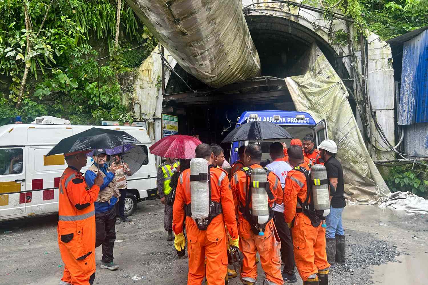 12 dead after tunnel explosion as rescuers rush to find 13 others still trapped by blast