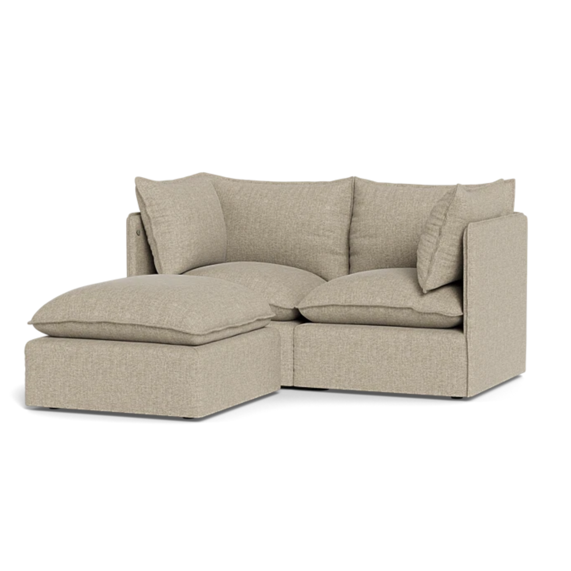 a tan sofa with an ottoman