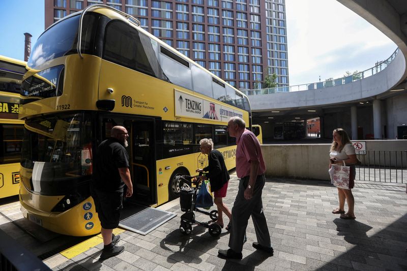 FILE PHOTO: Passengers board a Bee Network bus at Stockport Interchange in Stockport
