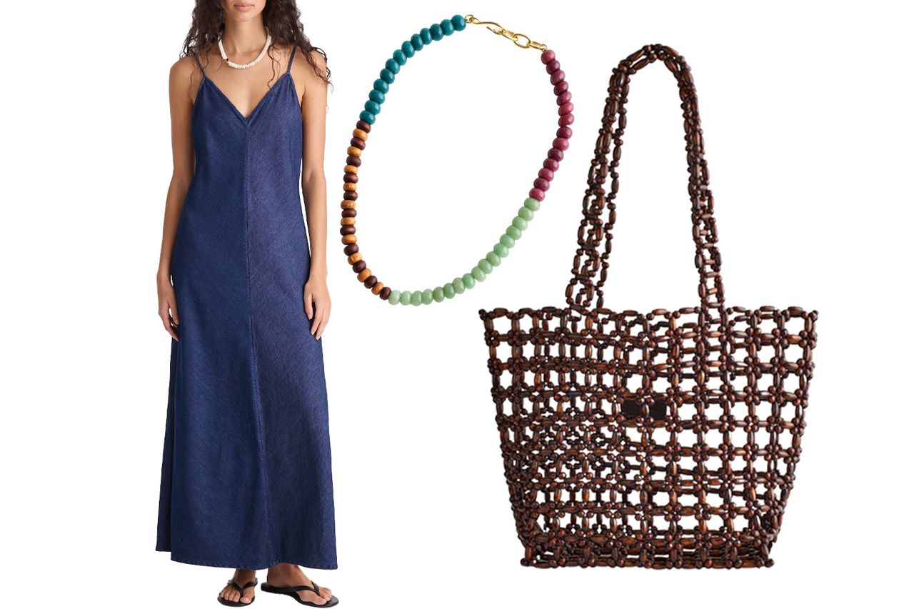 A denim dress on a model a beaded necklace and a woven tote bag