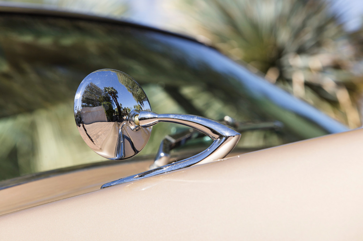 The Studebaker Avanti classic car’s side mirror