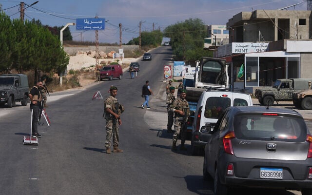 Lebanese soldiers search vehicles at a checkpoint at the entrance to Srifa village in southern Lebanon, July 21, 2026. (AP Photo/Hassan Ammar)