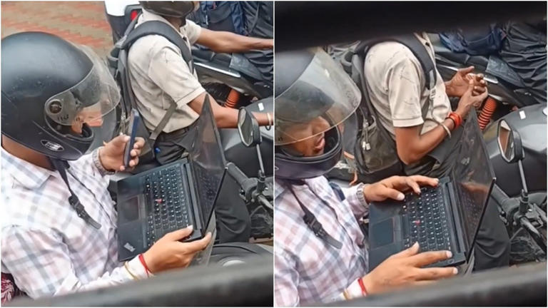 Traffic jam turns into office desk for man on bike. Work-life balance ...