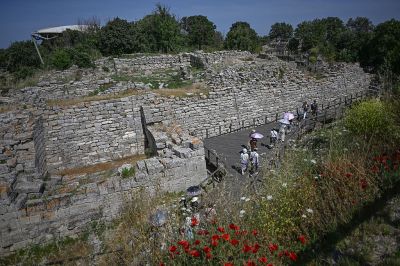 Visitors walk in the ruins of the ancient city of Troy in Çanakkale on June 2, 2026. A gift from the film set of
