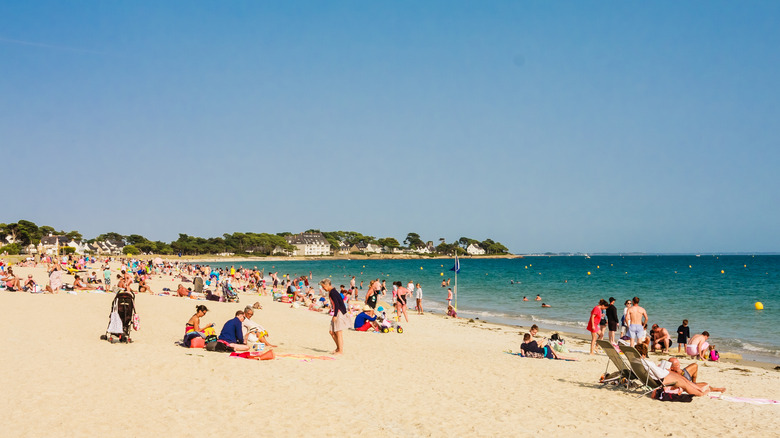 France's Version Of Stonehenge Has White Sand Beaches, Mysterious Ancient Monoliths, And A Quaint Coastal Village