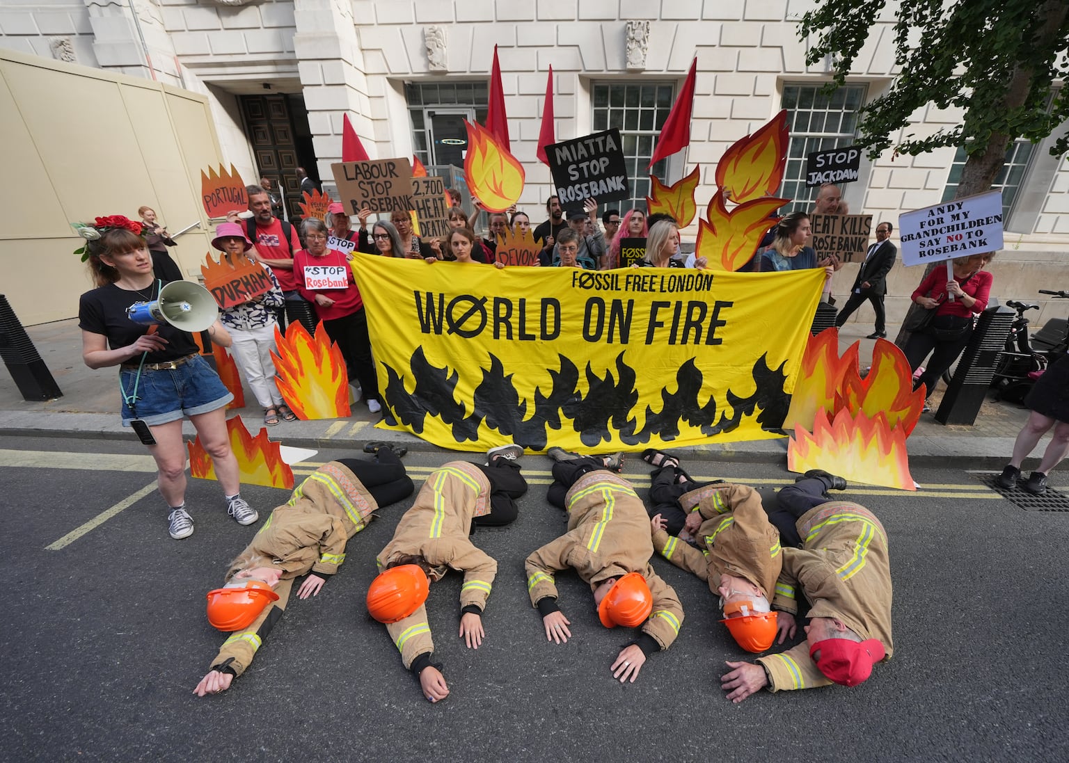 Campaigners dressed as firefighters