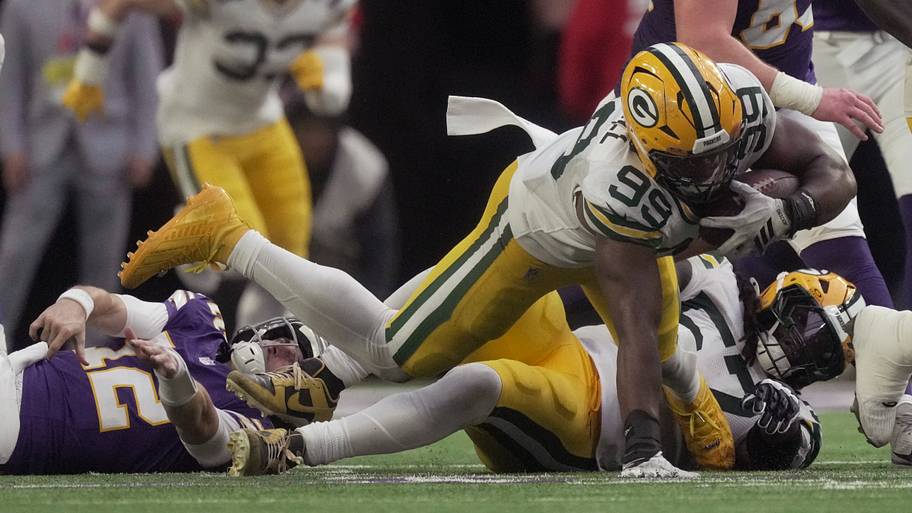 Green Bay Packers defensive end Barryn Sorrell (99) recovers a fumble by Minnesota Vikings quarterback Max Brosmer.