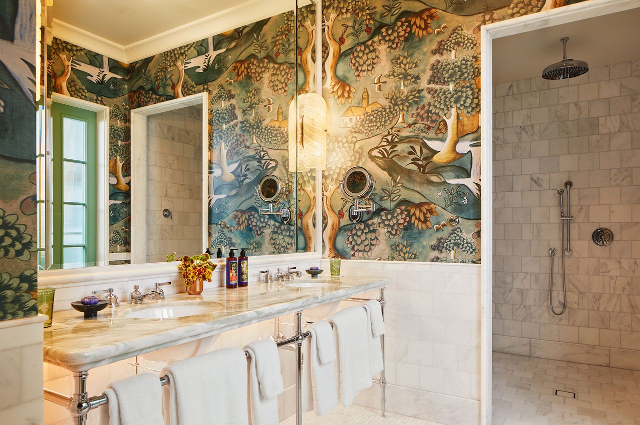 Luxurious bathroom with artistic wall design marble sink area and a spacious walkin shower
