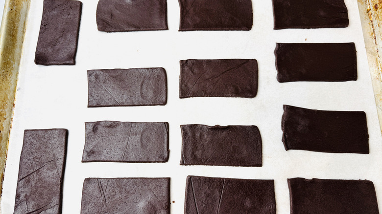 Chocolate cookie rectangles on baking sheet