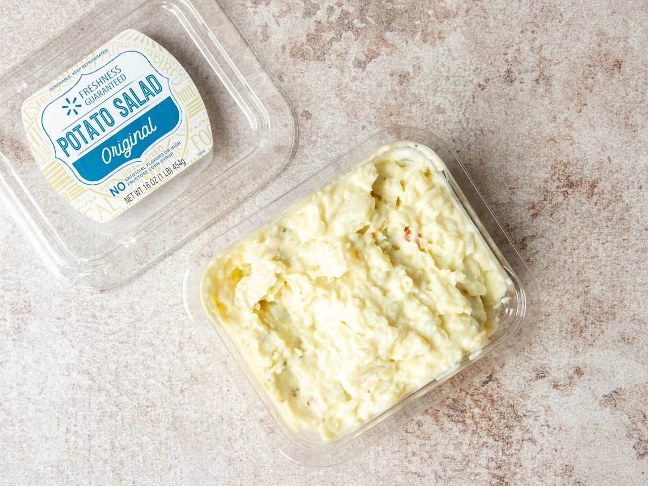 Two containers of Walmart Original potato salad open and revealed