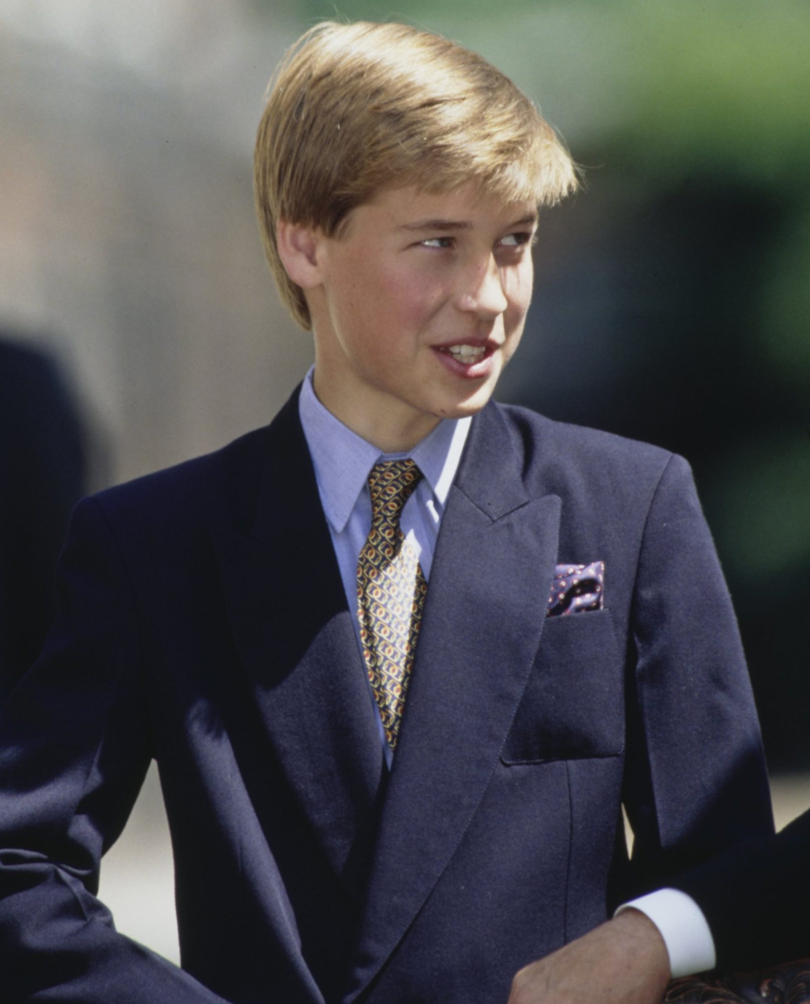 British Royal Prince William, wearing a blue blazer over a light blue shirt and a tie, marking the 95th birthday of his great grandmother Queen Elizabeth The Queen Mother, outside Clarence House in London, England, 4th August 1995. (Photo by Tim Graham Photo Library via Getty Images)