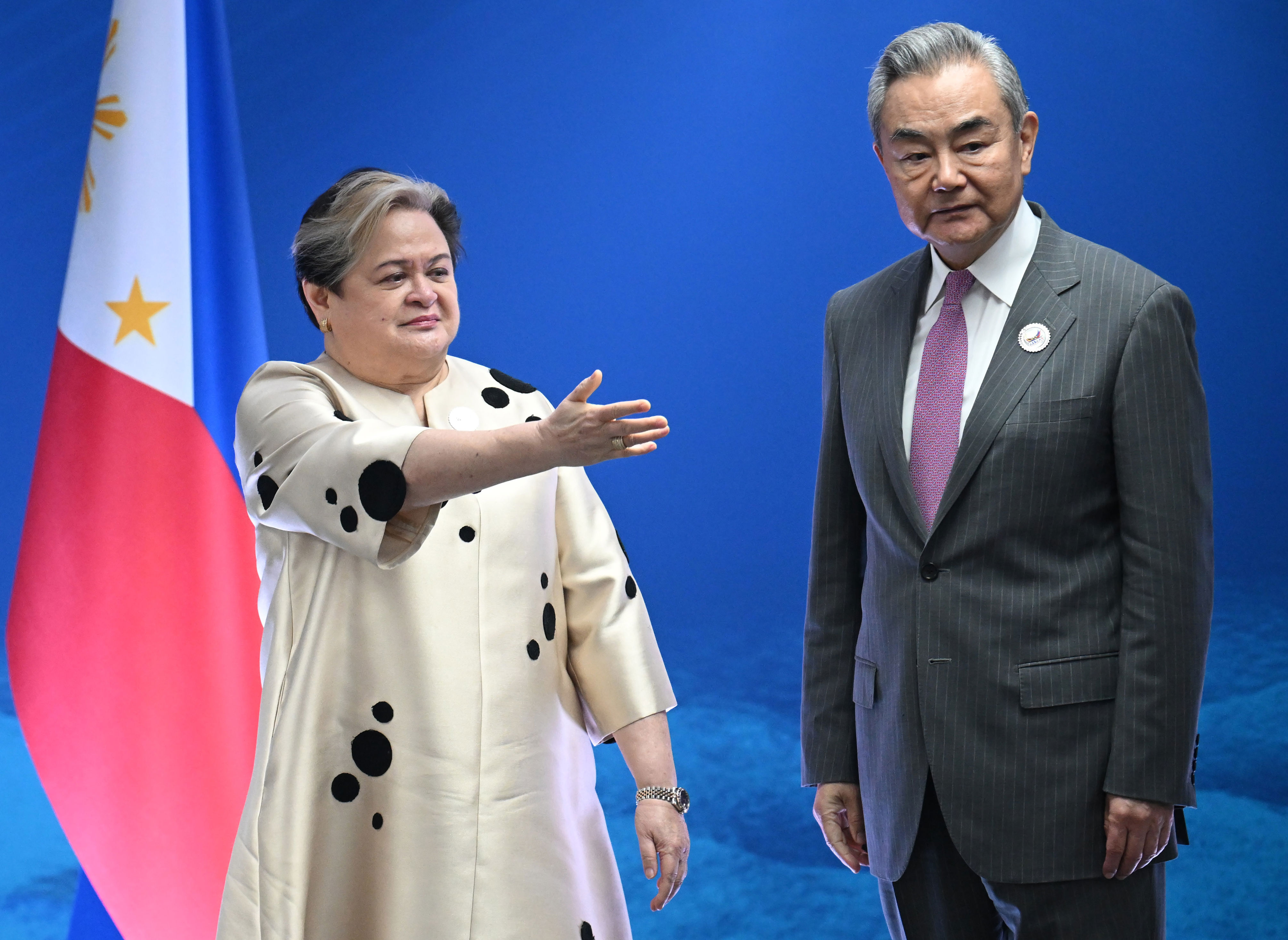 Philippines foreign secretary Theresa Lazaro with China’s Wang Yi (Getty)