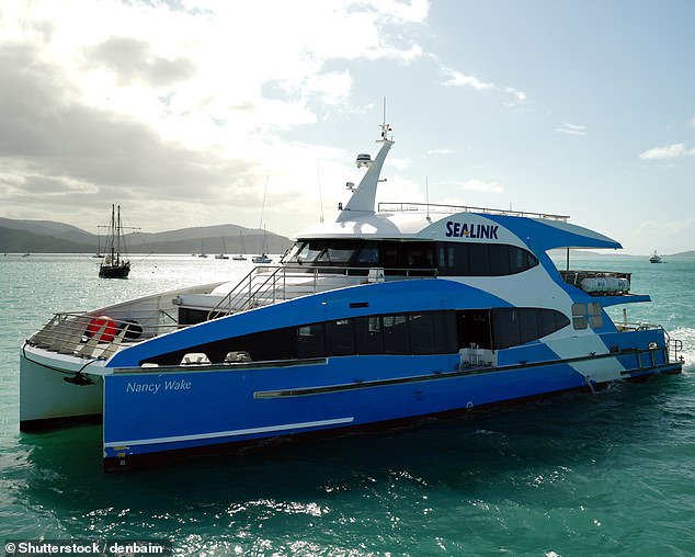 A Sealink marine and tourism boat (pictured) returning to port in the Whitsundays