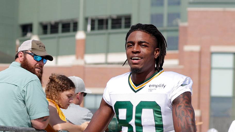 Green Bay Packers wide receiver Isaiah Neyor ride a bike to practice during training camp last year.
