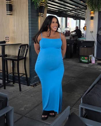 Another person in blue dress