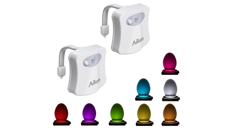 Stock photo of two toilet lights showing the various colors on toilets