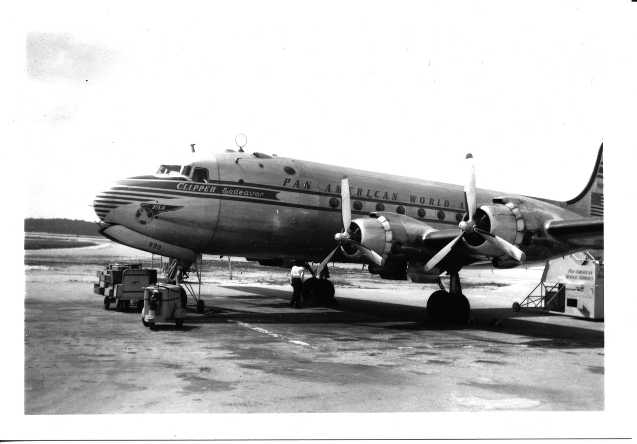 A black and white photograph of a commercial plane