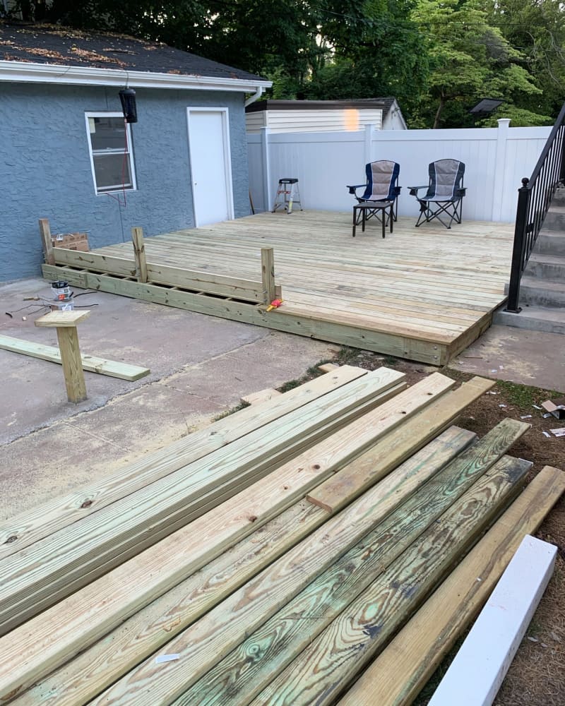 Wood deck being constructed in backyard during renovation.