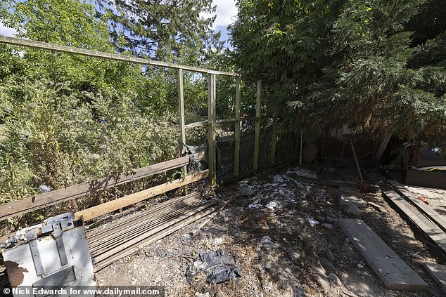 When The Daily Mail visited last week, there were holes and an empty frame where part of the couple's fence should lie