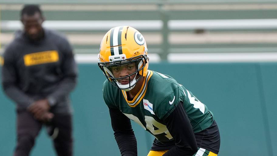 Green Bay Packers Carrington Valentine gets ready to tackle a dummy during an offseason practice.