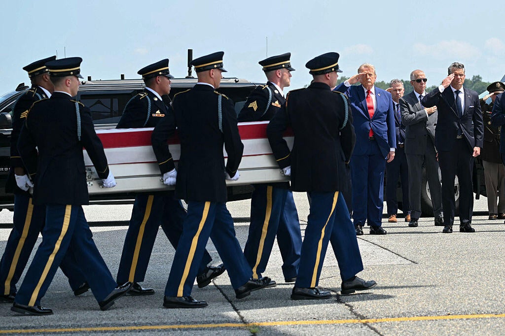 President Trump and Defense Secretary Pete Hegseth salute during a dignified transfer for Sgt. Angel S. Rampersad at Dover Air Force Base in Dover, Delaware, on July 22, 2026. / Credit: SAUL LOEB /AFP via Getty Images