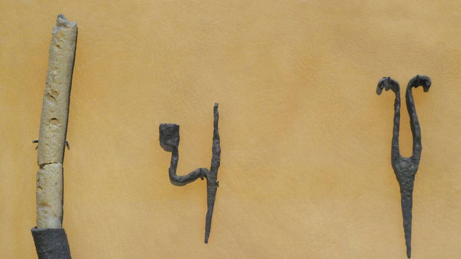 Holders for tallow candles inserted into the wall. Holder for pine torch.