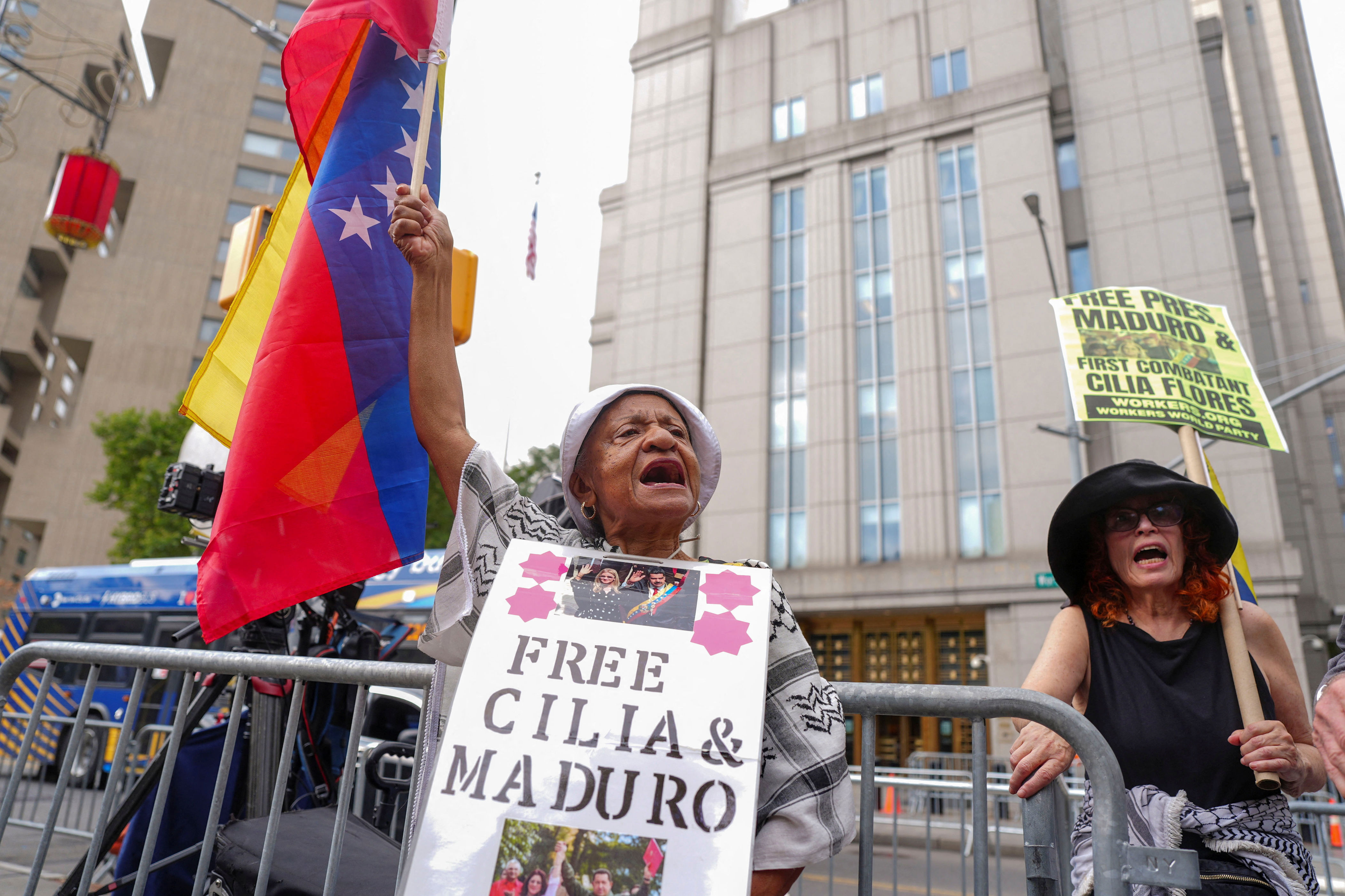 A person holds the Venezuelan flag.